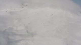 4K stock footage aerial video flyby snowy mountain slopes and clouds in Washington Aerial Stock Footage | WA004_086