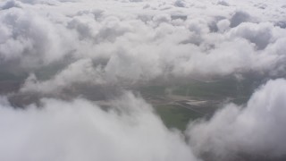 4K stock footage aerial video of farm fields and white clouds in Southern California Aerial Stock Footage | WA005_023