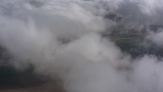 4K stock footage aerial video fly over clouds above farmland, Southern California Aerial Stock Footage | WA005_024