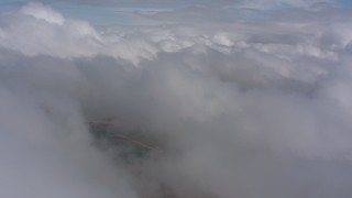 4K stock footage aerial video of passing white clouds over Southern California Aerial Stock Footage | WA005_025