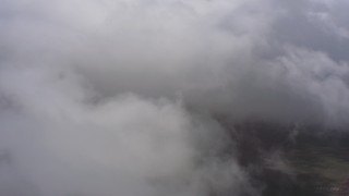 4K stock footage aerial video fly into dense white cloud cover over Southern California Aerial Stock Footage | WA005_026