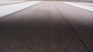 WA005_033 - 4K stock footage aerial video of a reverse view of lifting off from an airport runway in Kansas