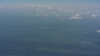 WA005_090 - 4K stock footage aerial video approach a cloud above West Virginia, and tilt up to a wider view of mountains and countryside