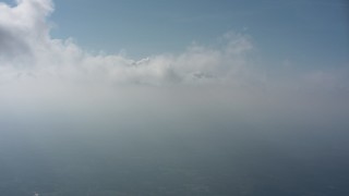 4K stock footage aerial video of a reverse view of clouds backlit by the sun over Virginia Aerial Stock Footage | WA006_011