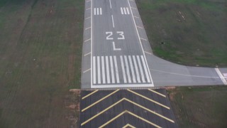 WA007_002 - 4K stock footage aerial video of a bird's eye view of a runway of a Greensboro airport, revealing roads and highways, farms and fields, North Carolina