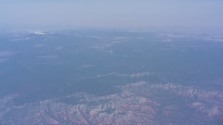 4K stock footage aerial video of a reverse view of mesas around the city, and tilt to reveal a distant mountain peak, Phoenix, Arizona Aerial Stock Footage | WA007_024