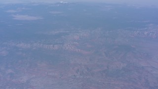 4K stock footage aerial video tilt from desert mountains to reveal mesas and a distant peak in Arizona Aerial Stock Footage | WA007_027