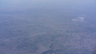 4K stock footage aerial video approach and tilt to the Southern California desert mountains below Aerial Stock Footage | WA007_028