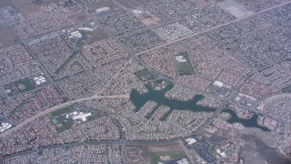 4K stock footage aerial video of a bird's eye view of suburban neighborhoods and lake in Moreno Valley, California Aerial Stock Footage | WA007_036