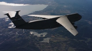 4K stock footage aerial video of a Lockheed C-5 in flight near a lake in Northern California Aerial Stock Footage | WAAF01_C033_0117BC