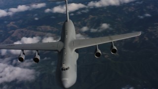 4K stock footage aerial video flyby front of a Lockheed C-5 jet in Northern California Aerial Stock Footage | WAAF01_C040_0117SL