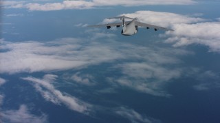 4K stock footage aerial video of a Lockheed C-5 dropping flares over the ocean in Northern California Aerial Stock Footage | WAAF01_C049_01170M