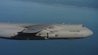 4K stock footage aerial video track and pan across the body of a Lockheed C-5 over the ocean in Northern California Aerial Stock Footage | WAAF01_C063_0117RC_S000