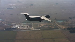 4K stock footage aerial video of a Lockheed C-5 approaching Travis Air Force Base in Northern California Aerial Stock Footage | WAAF01_C084_0117LC