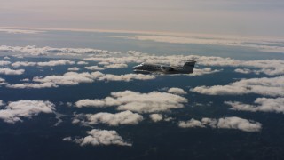 4K stock footage aerial video of a Learjet C-21 in flight over patchy clouds in Northern California Aerial Stock Footage | WAAF02_C025_01176W