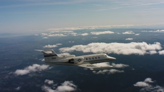 4K stock footage aerial video of a Learjet C-21 on its way to the ocean in Northern California Aerial Stock Footage | WAAF02_C029_0117CV