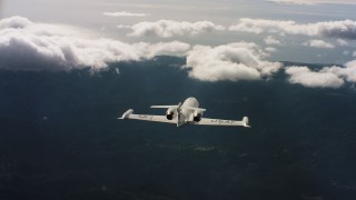 4K stock footage aerial video of following a Learjet C-21 toward the ocean in Northern California Aerial Stock Footage | WAAF02_C029_0117CV_S001