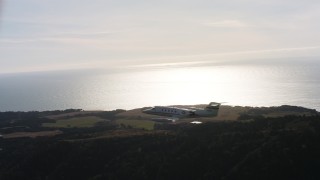 4K aerial stock footage video of a Learjet C-21 flying over hills on the coast in Northern California Aerial Stock Footage | WAAF02_C048_0117VK