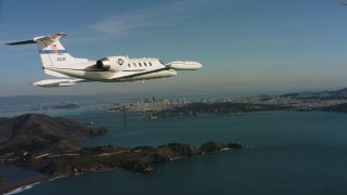 4K stock footage aerial video of a Learjet C-21 near Marin Hills, Golden Gate Bridge and San Francisco, California Aerial Stock Footage | WAAF02_C051_01170K_S000