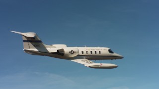 4K stock footage aerial video of a Learjet C-21 and blue skies in Northern California Aerial Stock Footage | WAAF02_C061_01177W