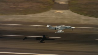 4K stock footage aerial video of a Learjet C-21 taking off from Travis Air Force Base, California Aerial Stock Footage | WAAF02_C066_0117D0_S000