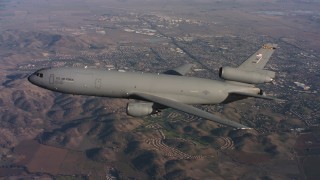 4K stock footage aerial video of a McDonnell Douglas KC-10 flying over hills in Northern California Aerial Stock Footage | WAAF03_C009_0118C0