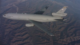 4K stock footage aerial video of a McDonnell Douglas KC-10 flying over hills in Northern California Aerial Stock Footage | WAAF03_C024_0118QQ