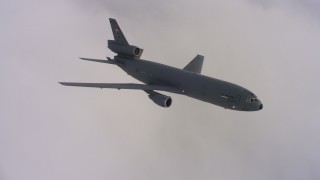 4K stock footage aerial video of a McDonnell Douglas KC-10 flying over a thick layer of cloud cover in Northern California Aerial Stock Footage | WAAF03_C036_0118RK