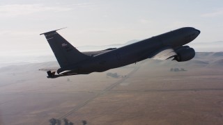 WAAF04_C007_01187P_S000 - 4K stock footage aerial video of a Boeing KC-135 in flight near Travis Air Force Base, California