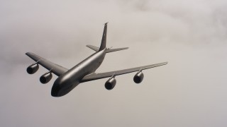 WAAF04_C074_0118RV_S000 - 4K stock footage aerial video of a Boeing KC-135 flying over low clouds; Northern California