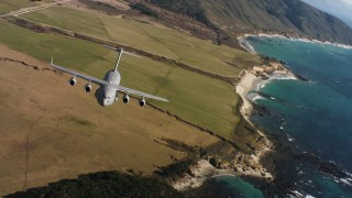 4K stock footage aerial video tilt from fields to reveal a Boeing C-17 on the coast of Northern California Aerial Stock Footage | WAAF05_C041_0118CP