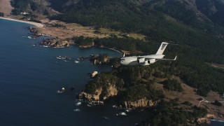 4K stock footage aerial video of a Boeing C-17 flying away from the coast of Northern California Aerial Stock Footage | WAAF05_C046_011850