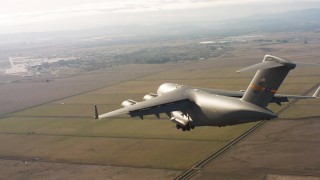 WAAF05_C078_0118X5 - 4K stock footage aerial video of a Boeing C-17 on approach to Travis Air Force Base, California