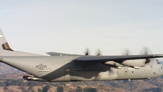 4K stock footage aerial video of the tail of a Lockheed Martin C-130J as cargo doors close at sunset, Northern California Aerial Stock Footage | WAAF06_C017_0119NN