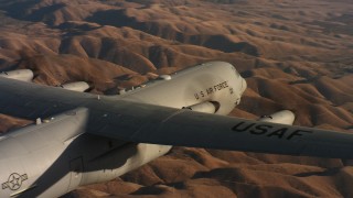 4K stock footage aerial video pan across the body of a Lockheed Martin C-130J at sunset in Northern California Aerial Stock Footage | WAAF06_C031_0119QR