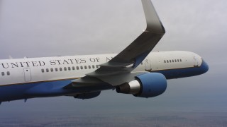 4K stock footage aerial video of a closer view of a Boeing C-32 flying over windmills in Northern California Aerial Stock Footage | WAAF08_C007_0119T2