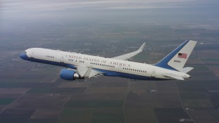 WAAF08_C017_0119R2 - 4K stock footage aerial video of a Boeing C-32 flying high above farmland in Northern California