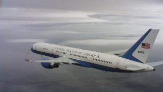 WAAF08_C024_0119EQ - 4K stock footage aerial video of a Boeing C-32 flying over misty clouds in Northern California