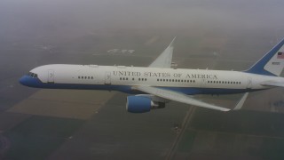 4K stock footage aerial video of a Boeing C-32 flying through misty clouds above Northern California Aerial Stock Footage | WAAF08_C024_0119EQ_S000