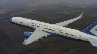 WAAF08_C024_0119EQ_S001 - 4K stock footage aerial video of a Boeing C-32 in the air above farmland in Northern California