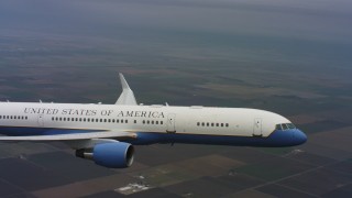 4K stock footage aerial video of a Boeing C-32 in flight over farm fields of Northern California  Aerial Stock Footage | WAAF08_C025_0119Q7