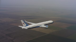 4K stock footage aerial video circle around the tail of a Boeing C-32 over farmland in Northern California Aerial Stock Footage | WAAF08_C032_0119FA