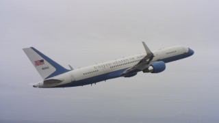 WAAF08_C034_0119DF_S001 - 4K stock footage aerial video of a Boeing C-32 ascending from Travis Air Force Base, California