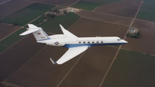 4K stock footage aerial video of a Gulfstream C-37A above farm fields in Northern California Aerial Stock Footage | WAAF08_C042_0119R4