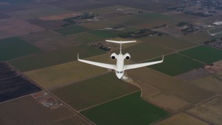 4K stock footage aerial video of a Gulfstream C-37A in flight over farms in Northern California Aerial Stock Footage | WAAF08_C044_0119CP