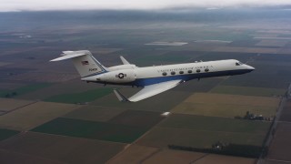 4K stock footage aerial video of a Gulfstream C-37A in the air above farmland in Northern California Aerial Stock Footage | WAAF08_C051_0120V3