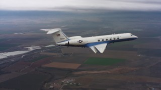 4K stock footage aerial video of a Gulfstream C-37A above farms and marshes in Northern California Aerial Stock Footage | WAAF08_C052_0120MV