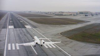 WAAF08_C064_0120W5 - 4K stock footage aerial video of a Gulfstream C-37A landing at Travis Air Force Base, California